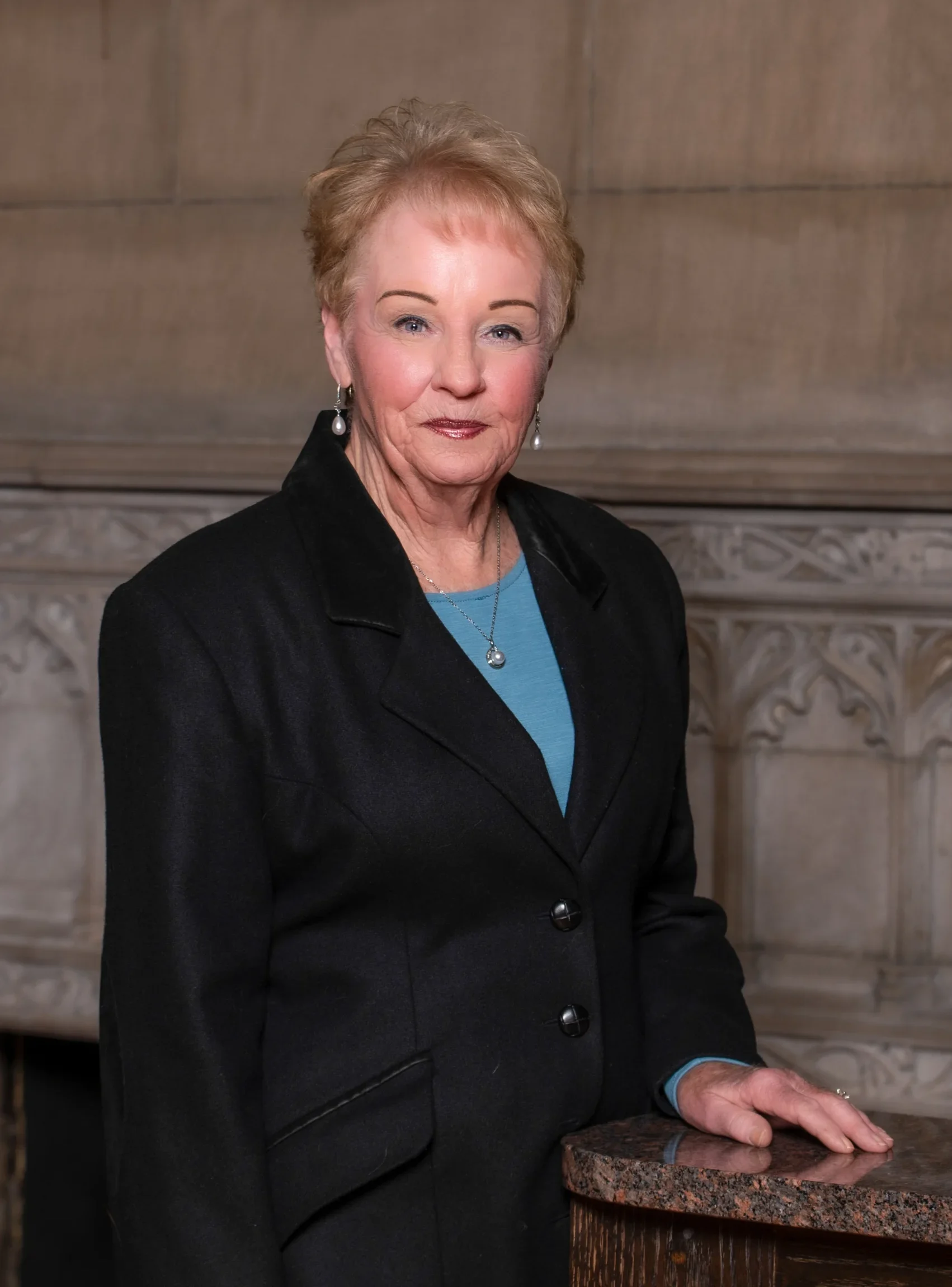 Kathy Kates Headshot on Marble