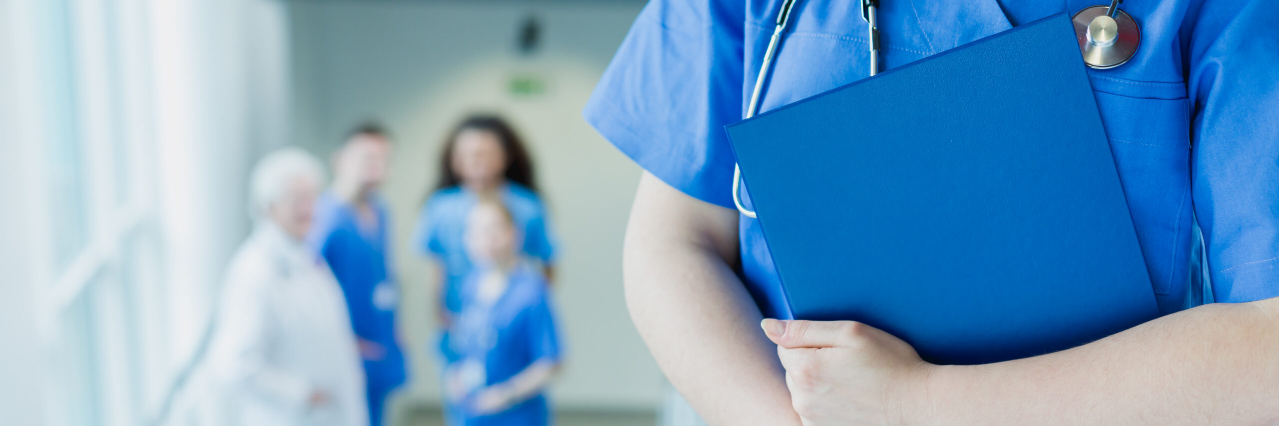 Doctor of medicine holding file